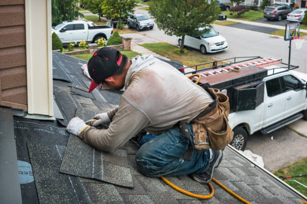 Professional Roofing technician working in Middle Island, NY